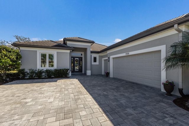 prairie-style house featuring a garage