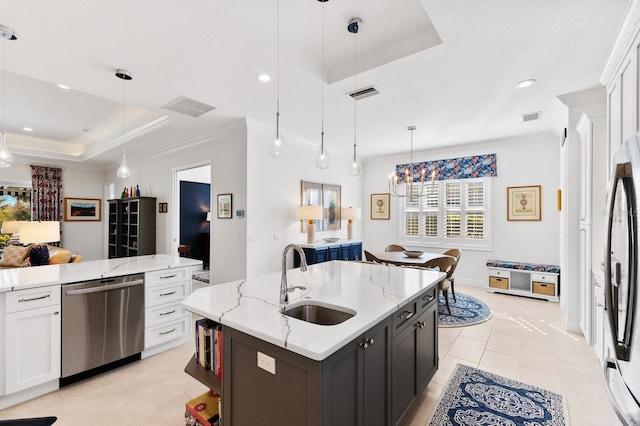 kitchen featuring a tray ceiling and white cabinetry