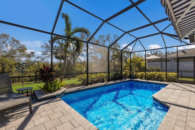 view of pool featuring a lanai and a patio area