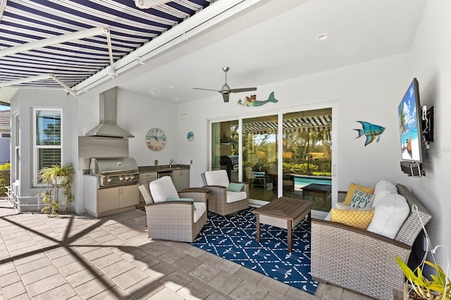 view of patio / terrace with a grill, outdoor lounge area, an outdoor kitchen, and sink