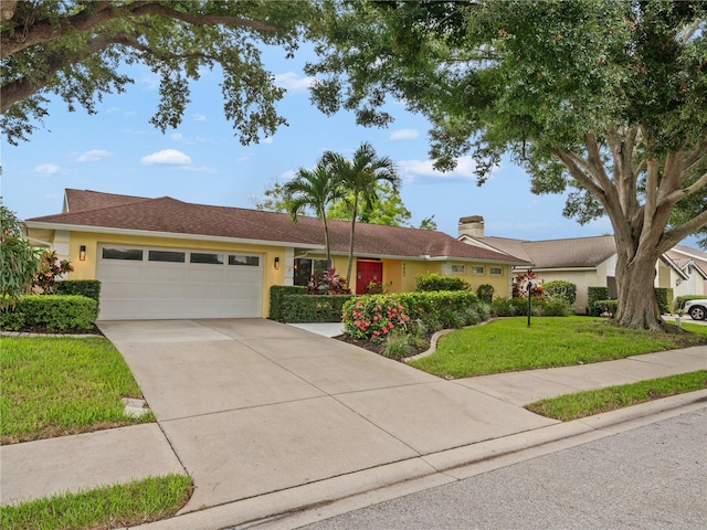 ranch-style home with a garage and a front yard