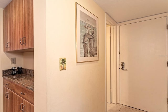 corridor with light tile patterned flooring