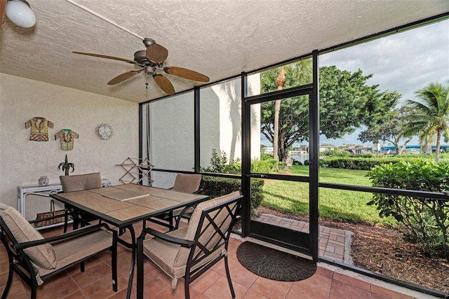 sunroom / solarium with ceiling fan