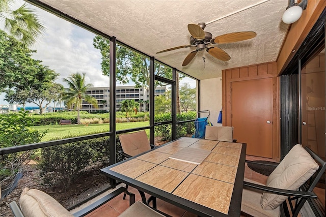 sunroom / solarium with ceiling fan