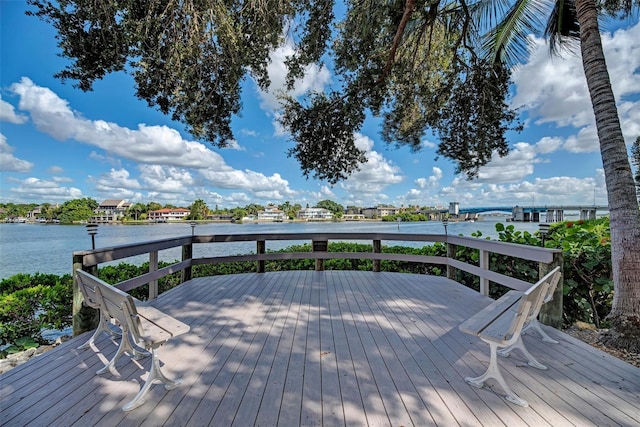 wooden terrace featuring a water view