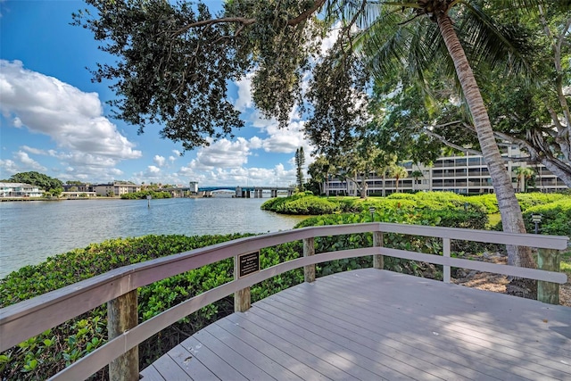 wooden terrace featuring a water view