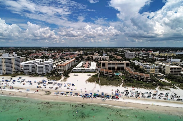 aerial view with a water view and a beach view