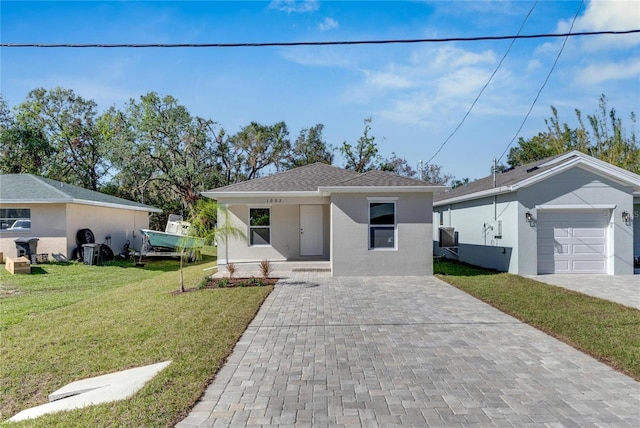 view of front of home with a porch, a garage, and a front yard