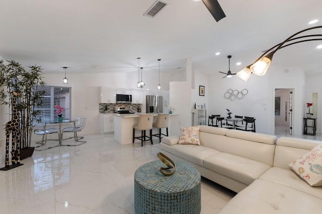 living room featuring ceiling fan