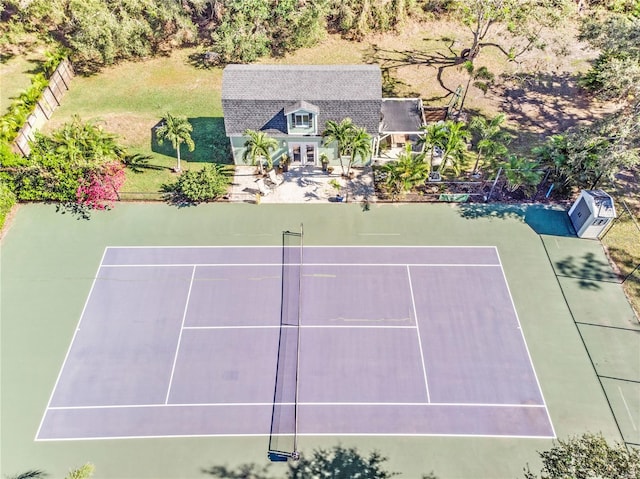 view of tennis court with fence