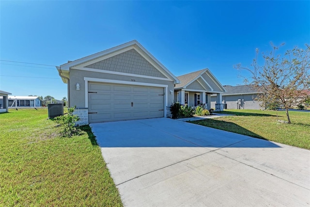 craftsman inspired home with cooling unit, a garage, and a front lawn