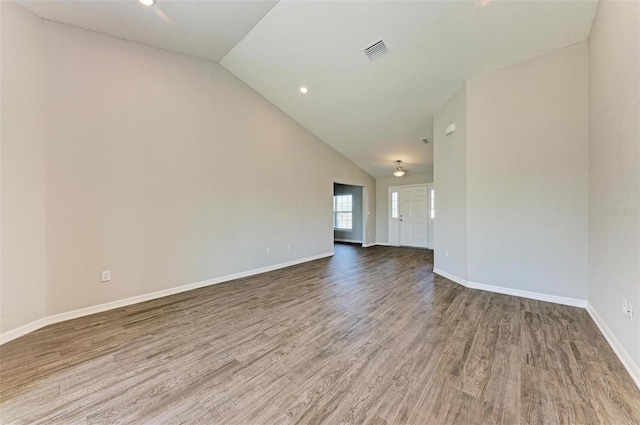 3030 58th Way E, Palmetto, FL 34221 - spare room with lofted ceiling, wood finished floors, baseboards, and recessed lighting