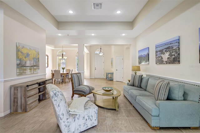17113 1st Dr E, Bradenton, FL 34212 - living room featuring an inviting chandelier