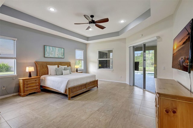 17113 1st Dr E, Bradenton, FL 34212 - bedroom with access to exterior, a raised ceiling, and ceiling fan