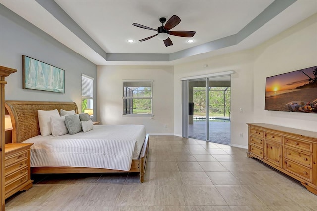17113 1st Dr E, Bradenton, FL 34212 - bedroom featuring a tray ceiling, access to exterior, and ceiling fan