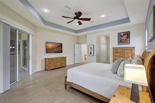 17113 1st Dr E, Bradenton, FL 34212 - bedroom with ceiling fan, access to outside, and a tray ceiling