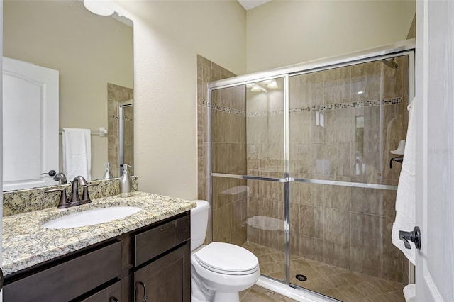 17113 1st Dr E, Bradenton, FL 34212 - bathroom featuring toilet, vanity, and a shower stall
