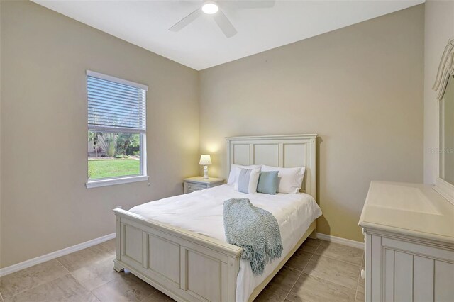 17113 1st Dr E, Bradenton, FL 34212 - bedroom featuring ceiling fan and light tile patterned floors