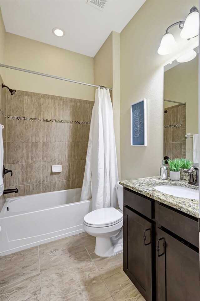 17113 1st Dr E, Bradenton, FL 34212 - full bathroom featuring vanity, toilet, and shower / tub combo with curtain