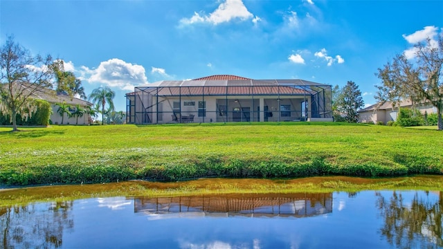 17113 1st Dr E, Bradenton, FL 34212 - rear view of property featuring a lanai, a yard, and a water view