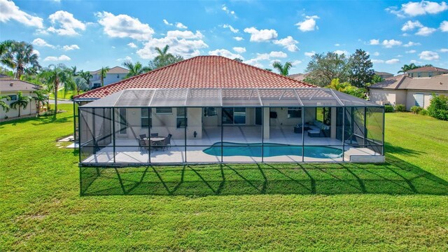 17113 1st Dr E, Bradenton, FL 34212 - view of pool featuring glass enclosure, a yard, and a patio
