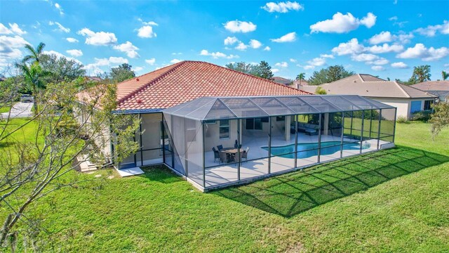 17113 1st Dr E, Bradenton, FL 34212 - rear view of property featuring a lawn, a lanai, and a patio