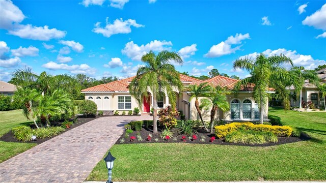 17113 1st Dr E, Bradenton, FL 34212 - mediterranean / spanish house with a front lawn