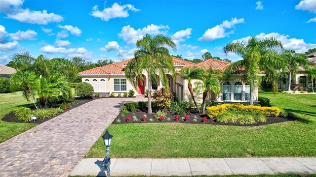 17113 1st Dr E, Bradenton, FL 34212 - mediterranean / spanish-style house with a front lawn