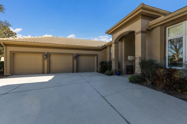 view of front of home with a garage