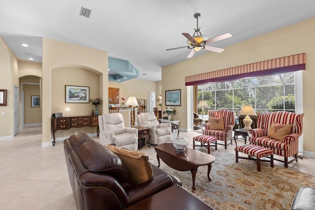 tiled living room featuring ceiling fan