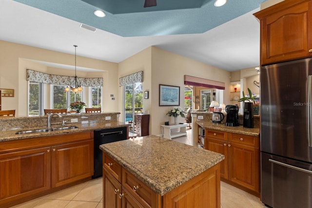 kitchen with stainless steel fridge, a center island, sink, a chandelier, and black dishwasher