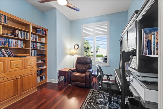 home office with ceiling fan and dark hardwood / wood-style flooring