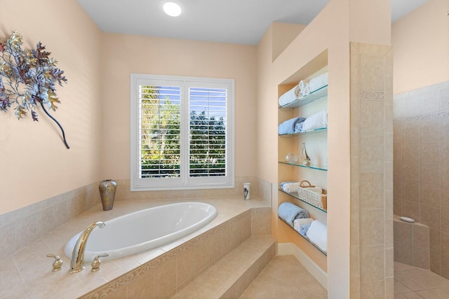 bathroom with tile patterned floors and plus walk in shower