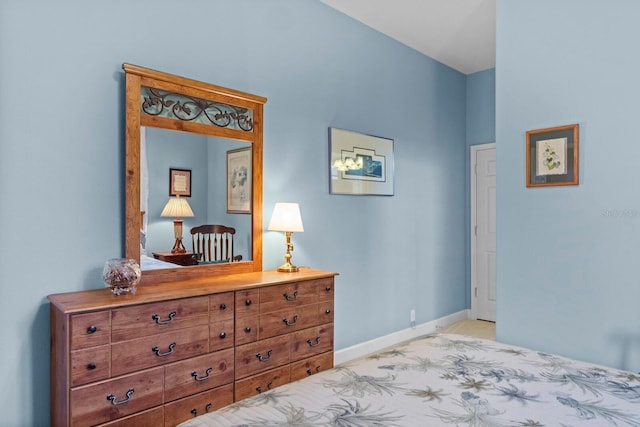 bedroom featuring light carpet