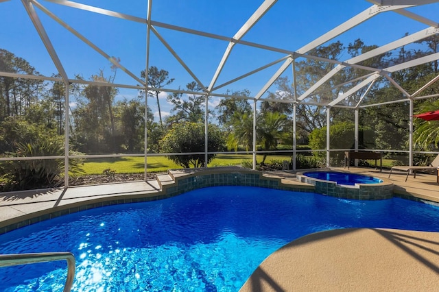 view of pool with a lanai, a patio area, and an in ground hot tub