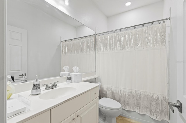 full bathroom featuring vanity, toilet, and shower / bath combo with shower curtain