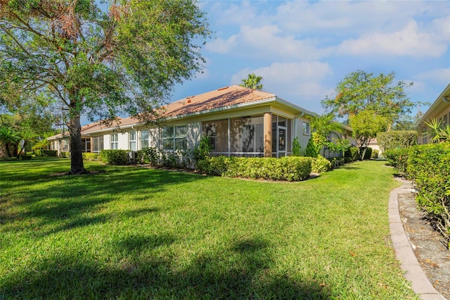 rear view of house with a yard