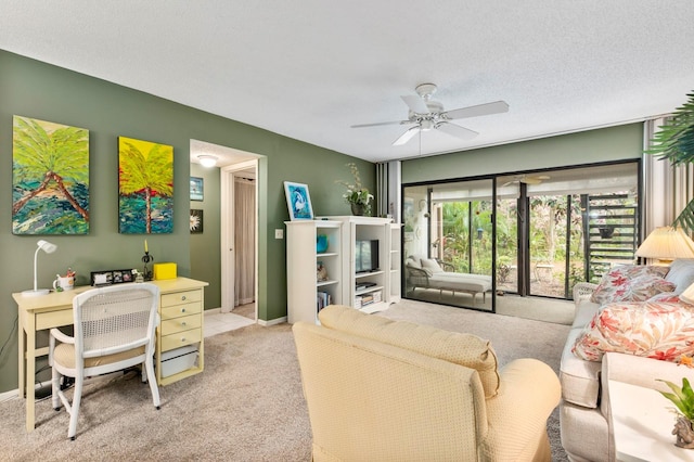 living room with a textured ceiling, ceiling fan, and light carpet