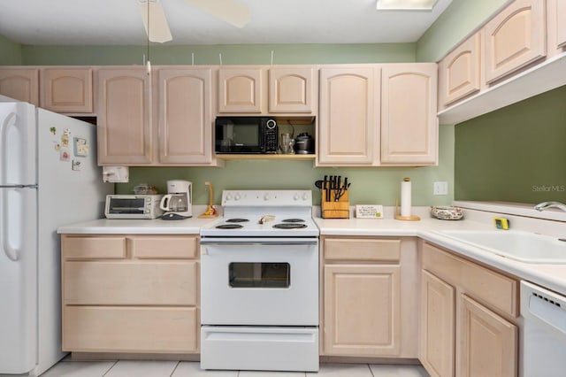 kitchen featuring light brown cabinets, white appliances, sink, ceiling fan, and light tile patterned floors