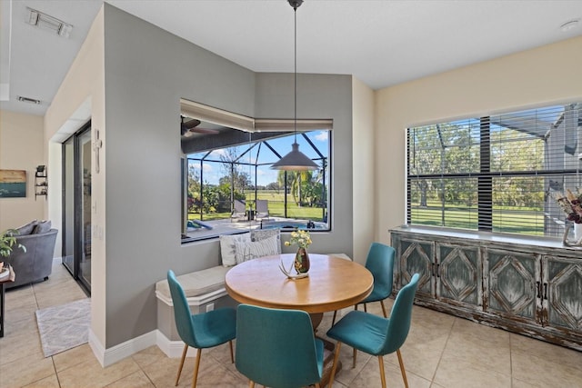 dining area with light tile patterned floors