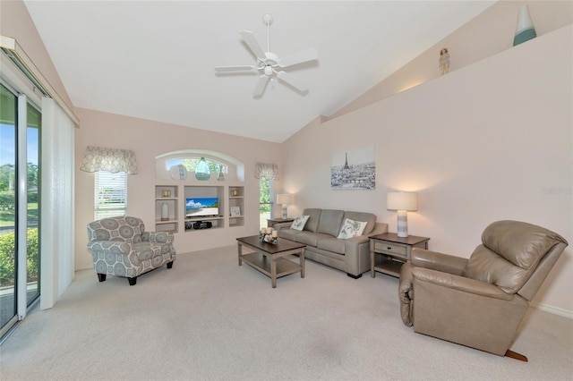 living room featuring light carpet, ceiling fan, and lofted ceiling