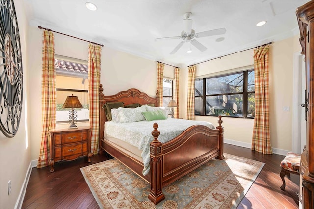 bedroom with dark hardwood / wood-style floors and ceiling fan