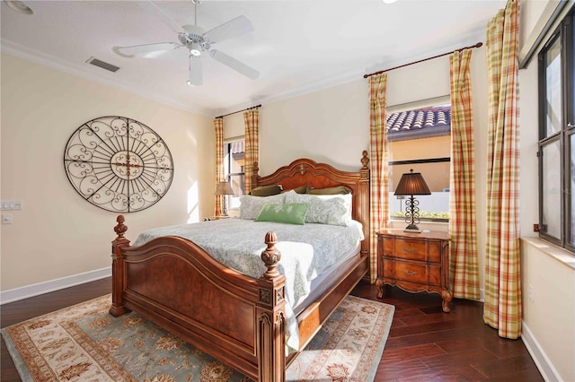 bedroom with multiple windows, ceiling fan, dark hardwood / wood-style flooring, and ornamental molding