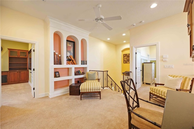 sitting room with light carpet and ceiling fan