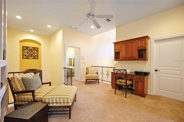 sitting room with light colored carpet and ceiling fan