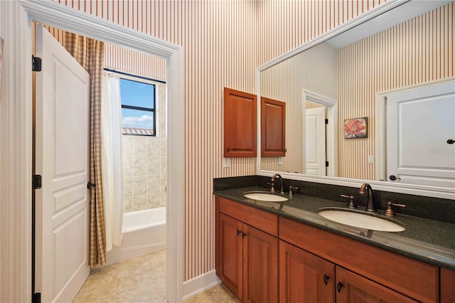 bathroom with tile patterned flooring, vanity, and shower / bath combo with shower curtain