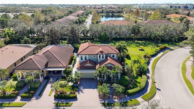 birds eye view of property with a water view