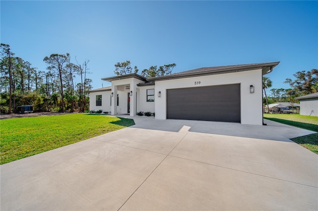 view of front facade with a front lawn and a garage