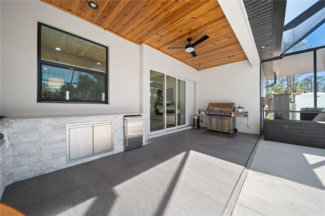 view of patio / terrace featuring area for grilling and ceiling fan