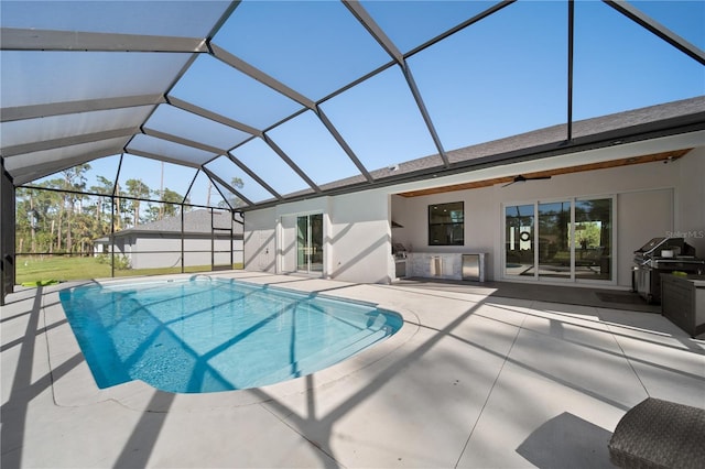 view of pool featuring ceiling fan, a lanai, and a patio